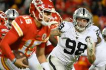 Oakland Raiders defensive end Maxx Crosby (98) chases Kansas City Chiefs quarterback Patrick Ma ...