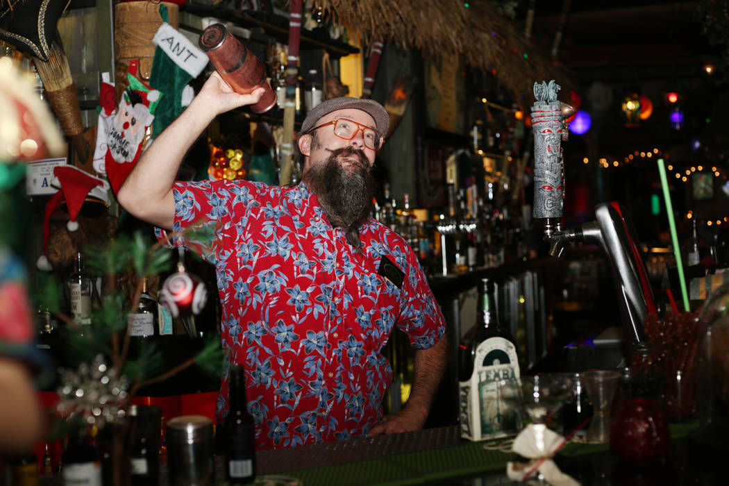 Lead bartender Adam Rains constructs a Baby Yoda cocktail at The Golden Tiki in Las Vegas on Mo ...