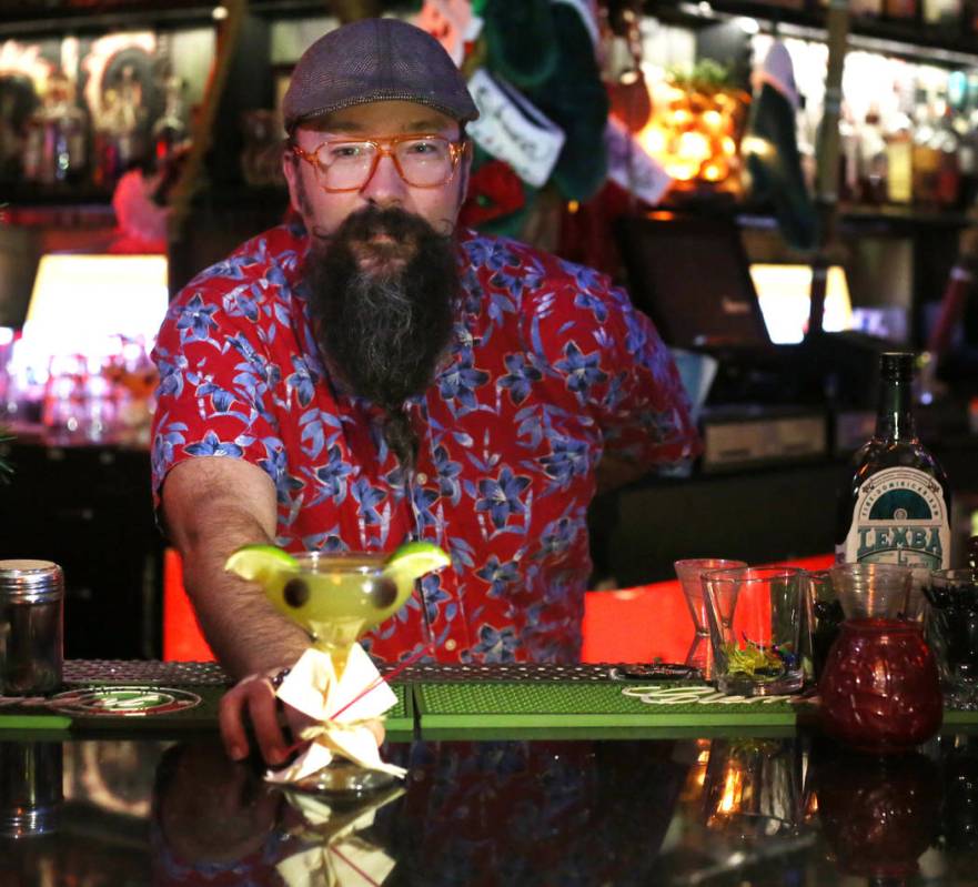 Lead bartender Adam Rains displays a Baby Yoda cocktail at The Golden Tiki in Las Vegas on Mond ...