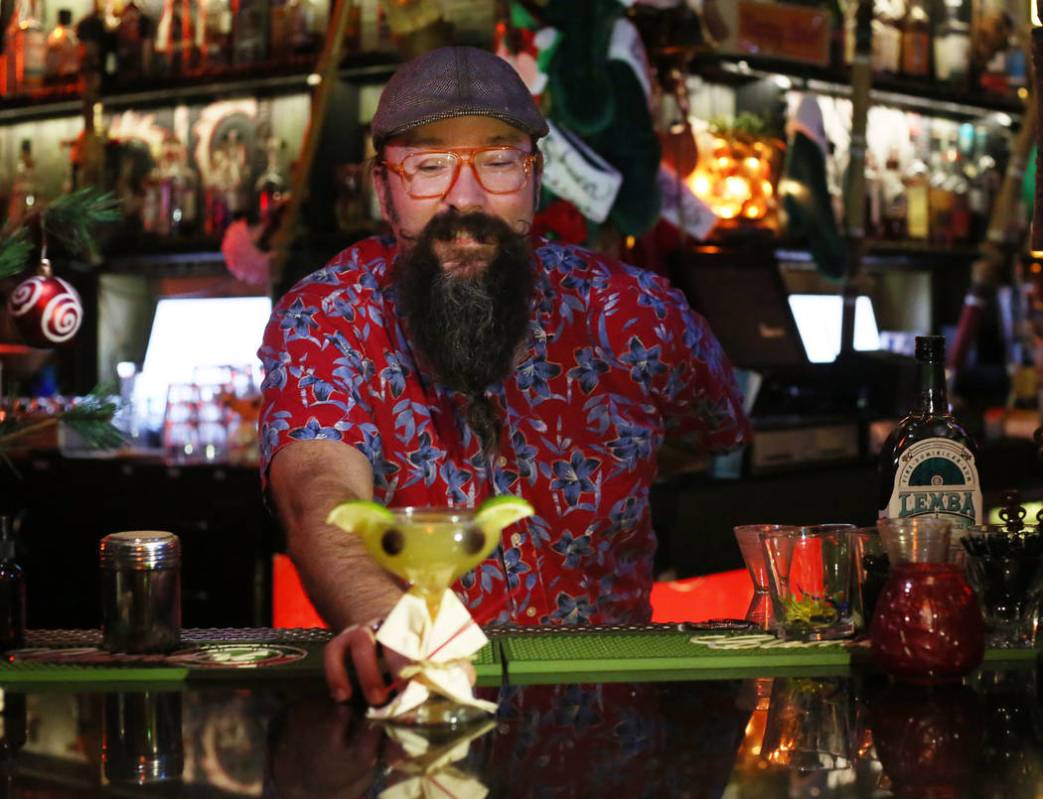 Lead bartender at The Golden Tiki displays a Baby Yoda cocktail at the tiki bar in Las Vegas on ...