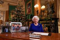 In this image released Tuesday Dec. 24, 2019, Britain's Queen Elizabeth II poses for a photo, w ...