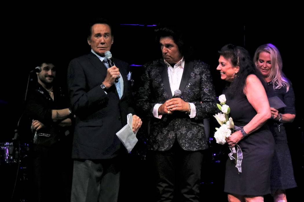 Vinny and Carol Adinolfi renew their vows Thursday with the help of Wayne Newton, left, at Mat ...