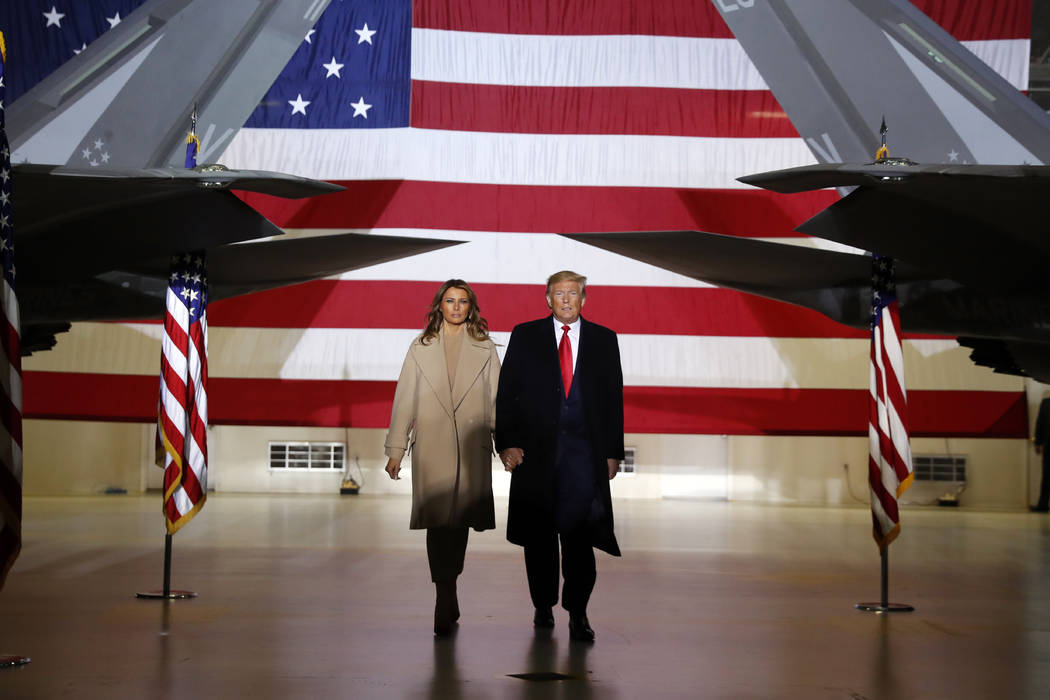 FILE - In this Dec. 20, 2019, file photo, President Donald Trump arrives with first lady Melani ...