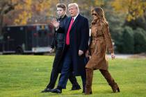 n a Nov. 26, 2019, file photo, President Donald, first lady Melania Trump, and Barron Trump, wa ...