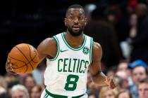 Boston Celtics guard Kemba Walker (8) dribbles the ball during the first half of an NBA basketb ...