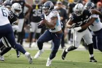 Tennessee Titans running back Derrick Henry (22) runs against the Oakland Raiders during the fi ...