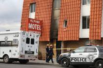 Las Vegas Police Department crime scene investigations truck is parked outside the Alpine Motel ...