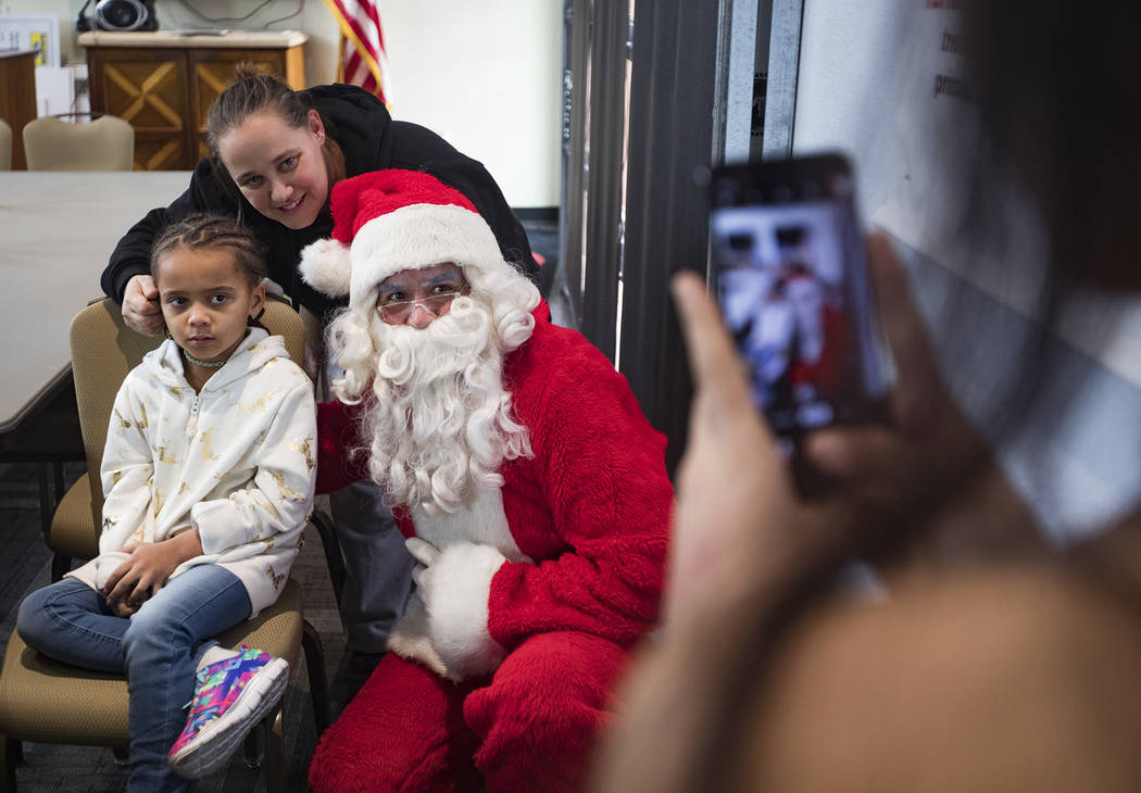 Maya Rodriguez, 7, left, and her mom Michelle Rodriguez, center, both survivors of the Alpine M ...
