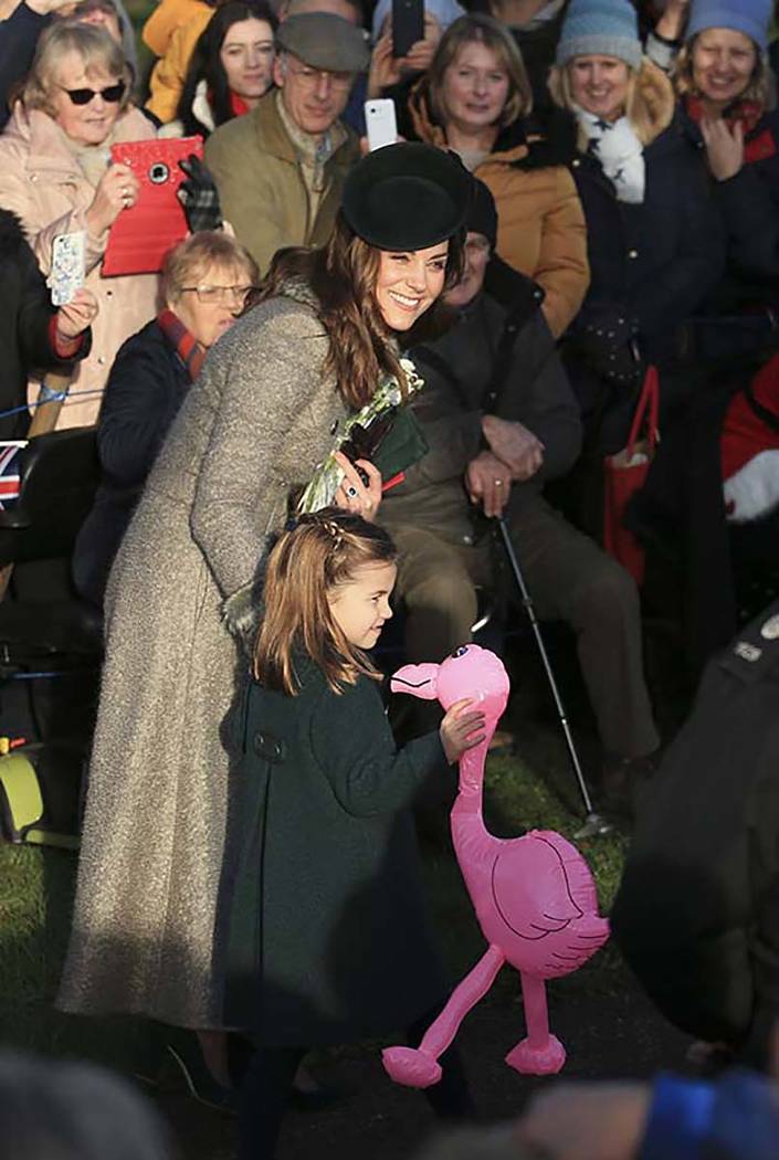 Britain's Catherine, Duchess of Cambridge, center left, speaks with her daughter Princess Charl ...