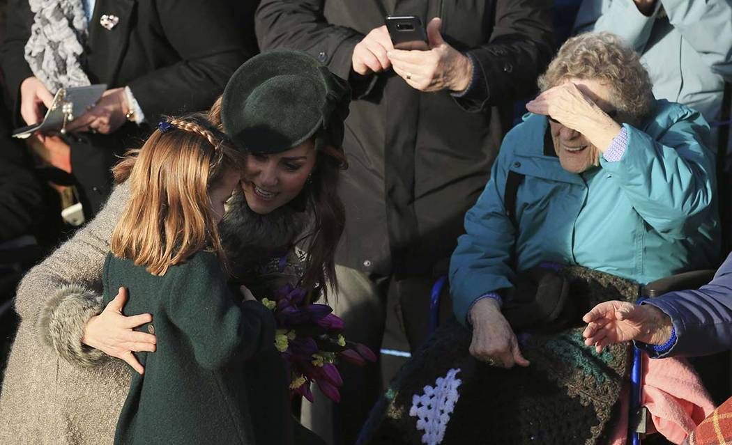 Catherine, Duchess of Cambridge and her daughter Princess Charlotte greet the public after atte ...