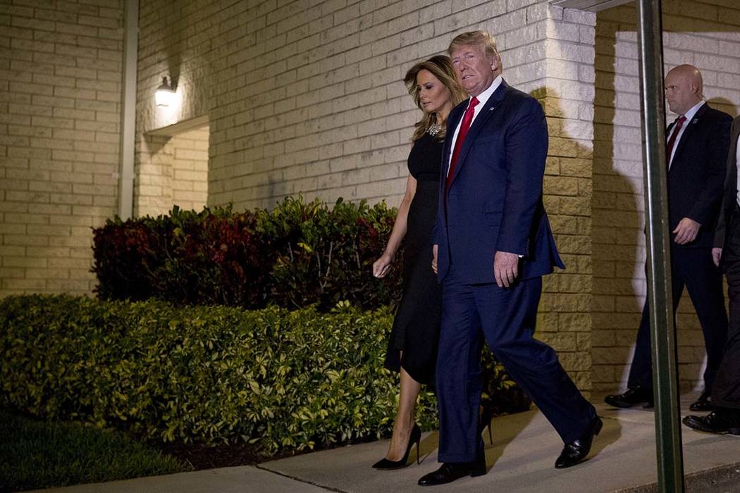 President Donald Trump and first lady Melania Trump leave Christmas Eve service at Family Churc ...