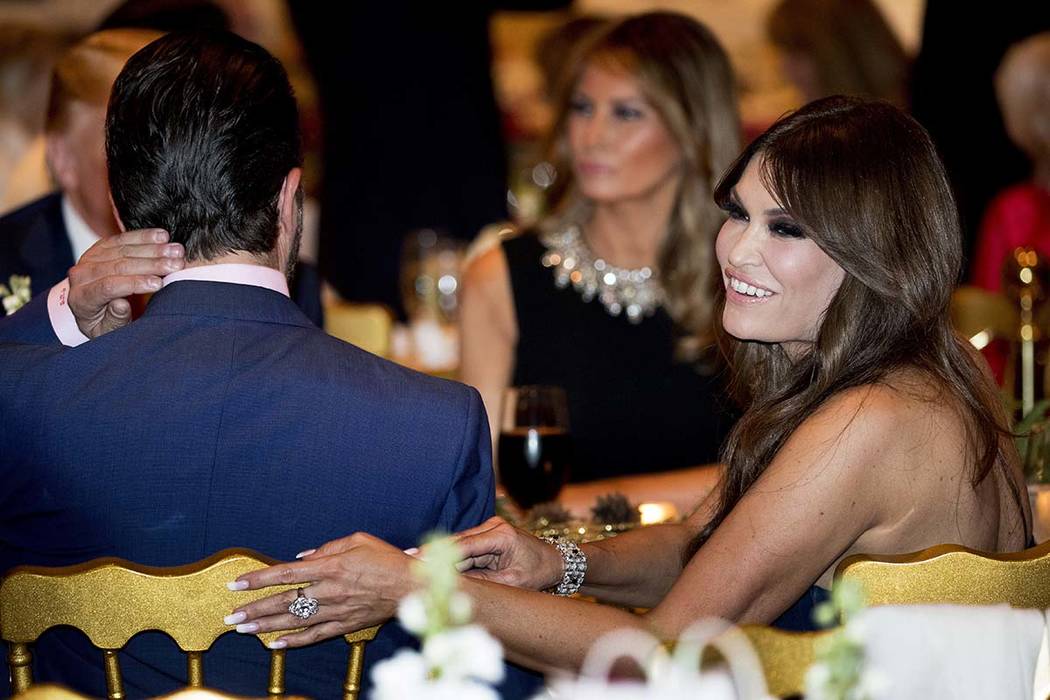 Kimberly Guilfoyle, right, and Donald Trump Jr., the son of President Donald Trump, left, sit w ...