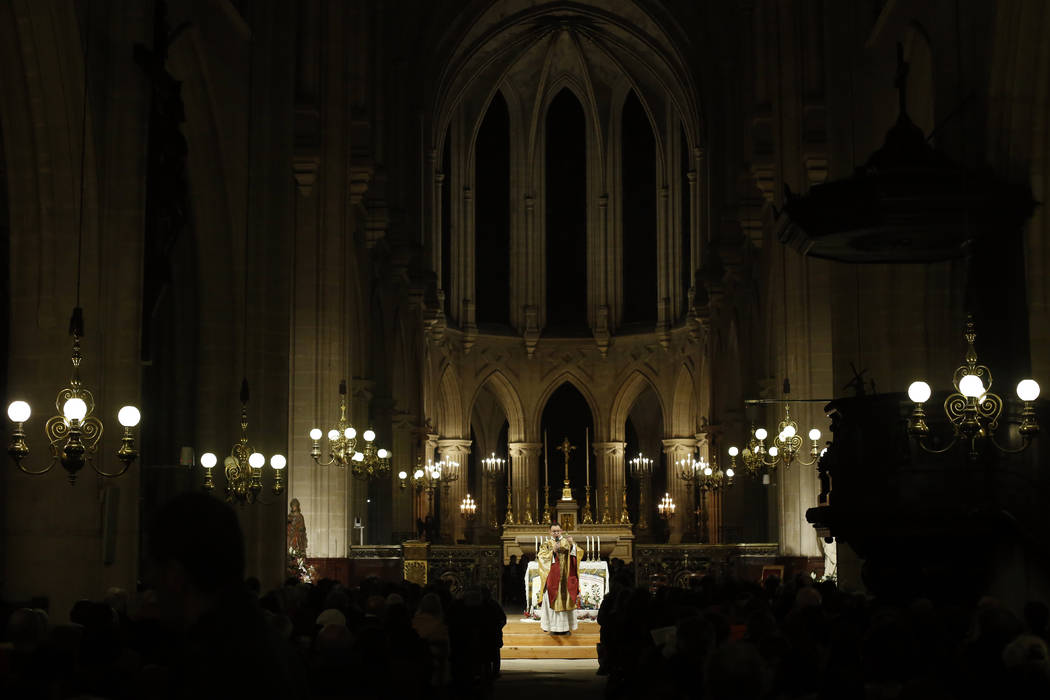 Priest Jean-Philippe Fabre celebrates the christmas mass, in Saint-Germain l'Auxerrois church, ...