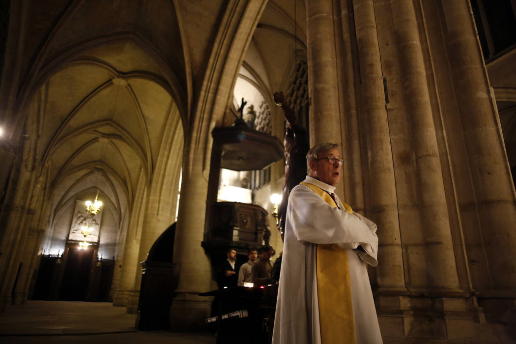 Notre Dame cathedral rector Patrick Chauvet attends the christmas mass, in Saint-Germain l'Auxe ...