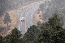 Snow falls along State Route 157, also known as Kyle Canyon Road at Mount Charleston on Wednesd ...