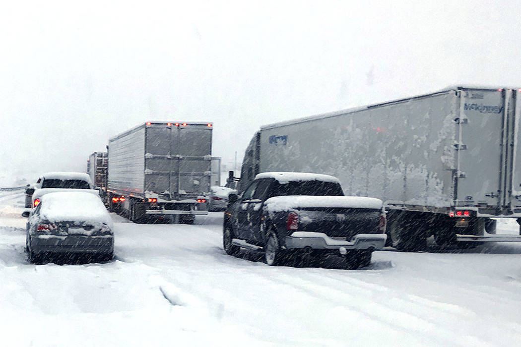 This photo shows a snow covered northbound I-15 in the Cajon Pass between the San Bernardino Mo ...