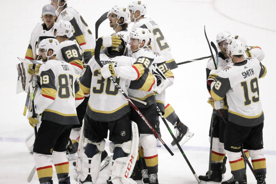 Vegas Golden Knights players celebrate after beating the Nashville Predators 4-3 in overtime of ...