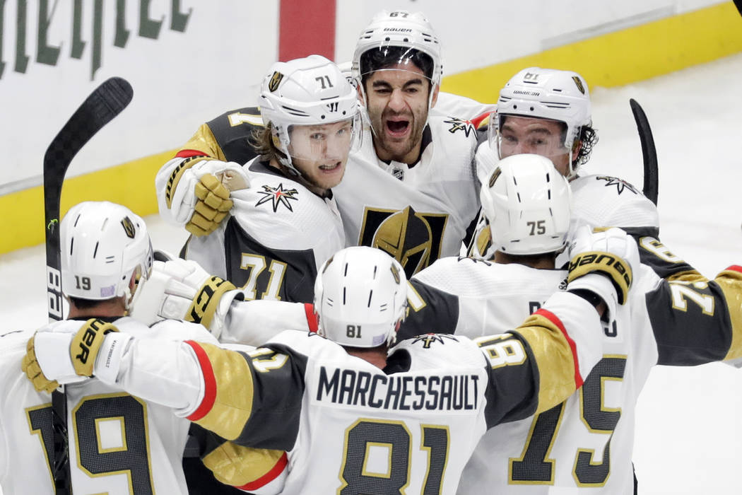 Vegas Golden Knights left wing Max Pacioretty (67), top center, celebrates with teammates after ...