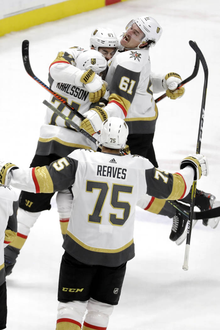 Vegas Golden Knights left wing Max Pacioretty (67), top center, celebrates with Mark Stone (61) ...