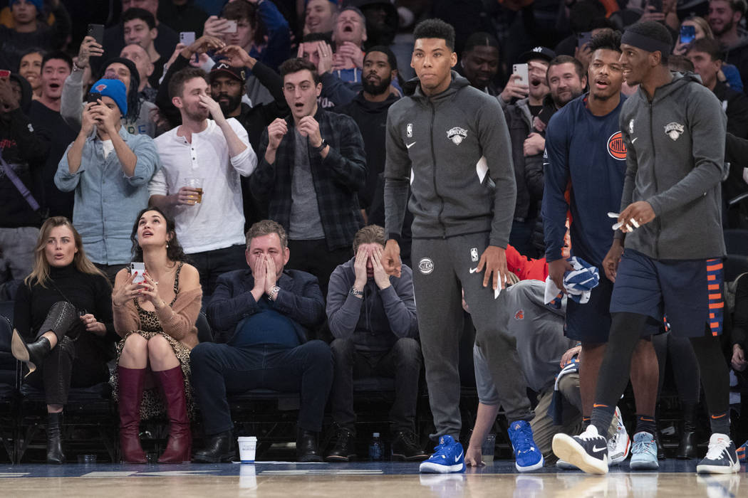 Executive chairman and Madison Square Garden CEO James Dolan, third from bottom left, fans, and ...