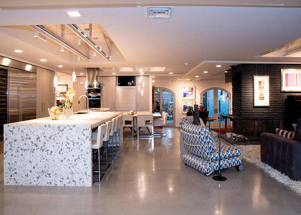The kitchen features an island with seating. (Tonya Harvey Real Estate Millions)