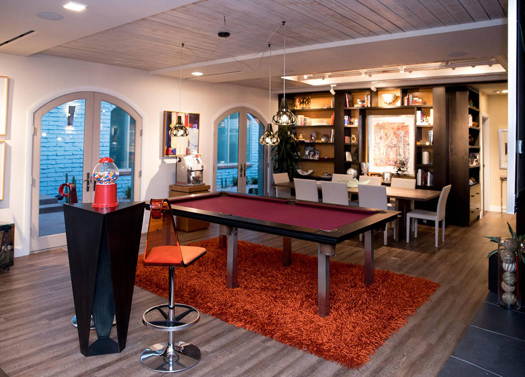Part of the living room also serves as a game room. (Tonya Harvey Real Estate Millions)