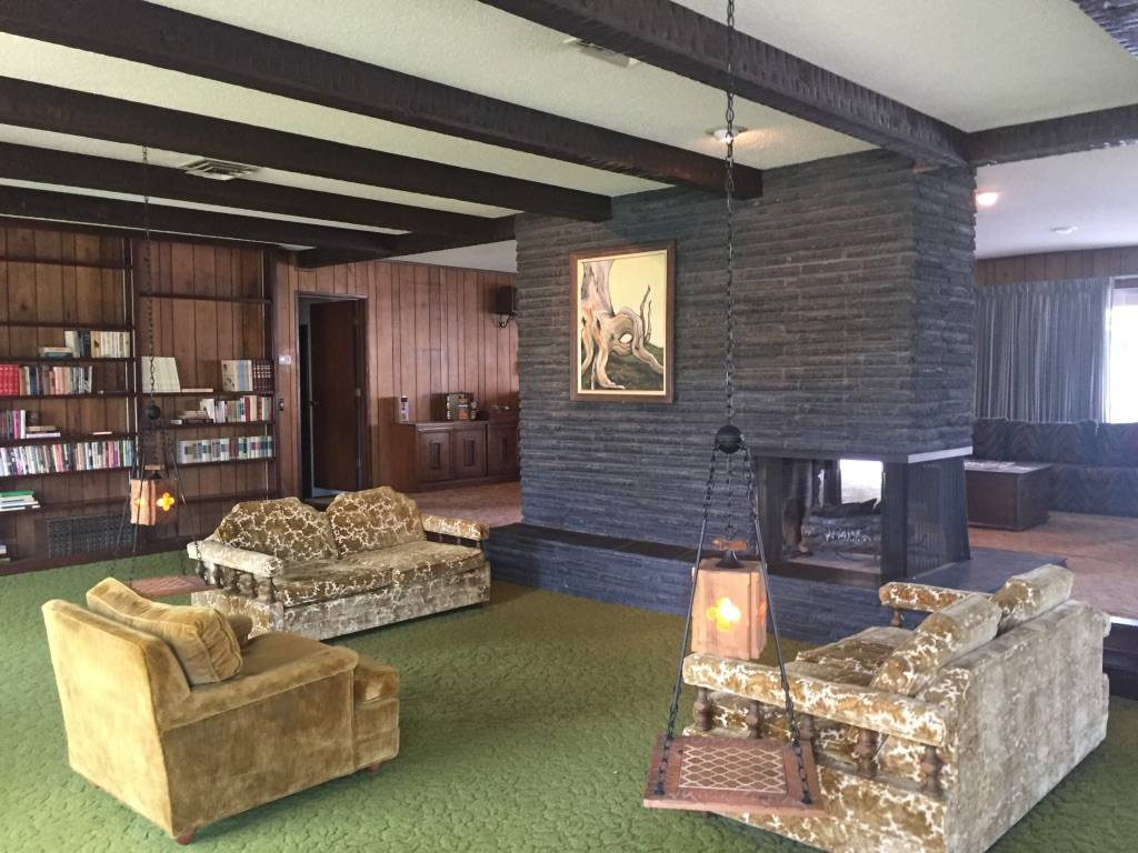 BEFORE: The living room and fireplace. (Jon Sparer)