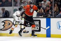 Anaheim Ducks' Nicolas Deslauriers, right, collides with Vegas Golden Knights' Alex Tuch (89) d ...