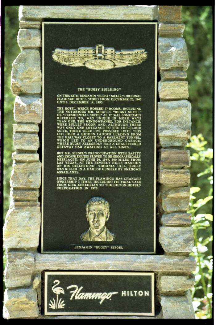 This 1997 photo shows the images of a commemorative plaque located at the Flamingo Hilton. The ...