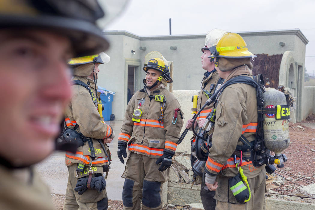 The Clark County Fire Department conducts a live fire training on a house located at 7051 W. Pe ...
