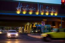 Traffic moves along Bonanza Road past the Historic Westside sign above F Street in Las Vegas on ...
