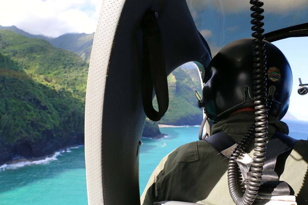 This photo shows a Coast Guard search and rescue team looking over Napali Coast State Wildernes ...