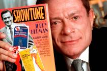 In a Nov. 19, 1996, file photo, composer Jerry Herman displays his book "Showtune," in New York ...
