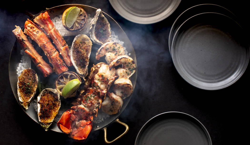 Shellfish platters are served hot, not chilled, at International Smoke. (Mina Group)