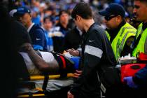 Oakland Raiders cornerback Trayvon Mullen is carted off the field on a gurney during the second ...