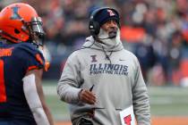Illinois head coach Lovie Smith looks up at the scoreboard during the second half of an NCAA co ...