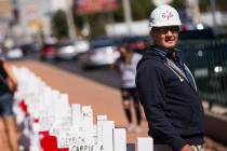 Greg Zanis stands by the 58 crosses he placed near the "Welcome to Fabulous Las Vegas&quot ...