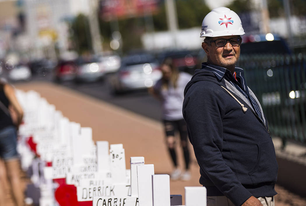 Greg Zanis stands by the 58 crosses he placed near the "Welcome to Fabulous Las Vegas&quot ...