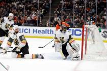 Vegas Golden Knights goaltender Malcolm Subban, right, gives up a goal on a shot from Anaheim D ...