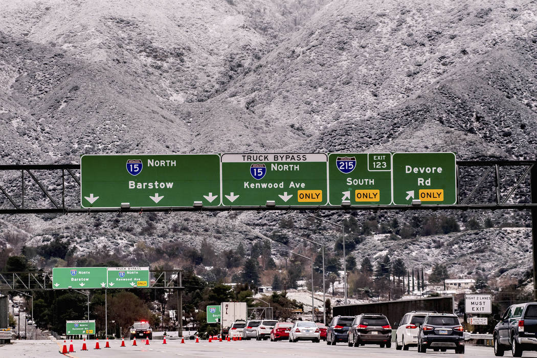 Vehicles are diverted off the northbound 15 Freeway to Kenwood Ave. on-ramp as Cajon Pass is sh ...