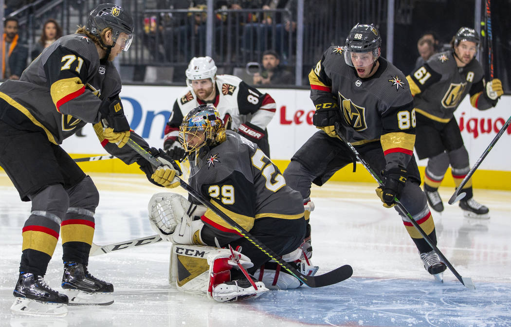 Vegas Golden Knights goaltender Marc-Andre Fleury (29, center) stops a power-play shot on goal ...