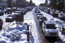 Cars wait to enter the South Rim at Grand Canyon National Park in Arizona on Saturday, Dec. 28, ...