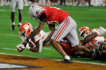 Clemson running back Travis Etienne scores against Ohio State during the second half of the Fie ...