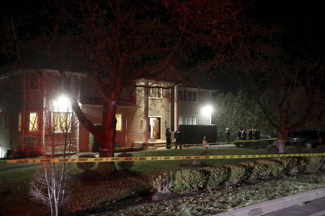 Police work the scene of a residence in Monsey, N.Y., early Sunday, Dec. 29, 2019, following a ...