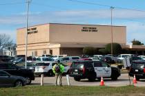 A person stands near the scene of a church shooting at West Freeway Church of Christ on Sunday, ...