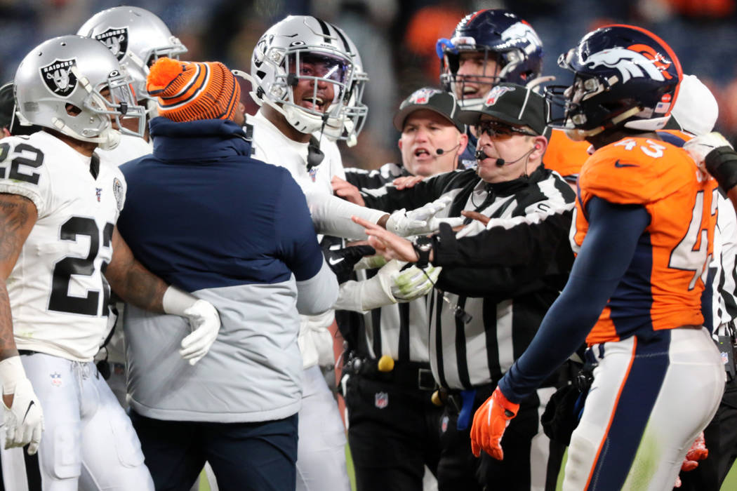 Oakland Raiders cornerback Isaiah Johnson (31), defensive back Keisean Nixon (22) are separated ...