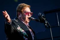 British singer Elton John performs on the stage of the "stade de la Saussaz" during h ...