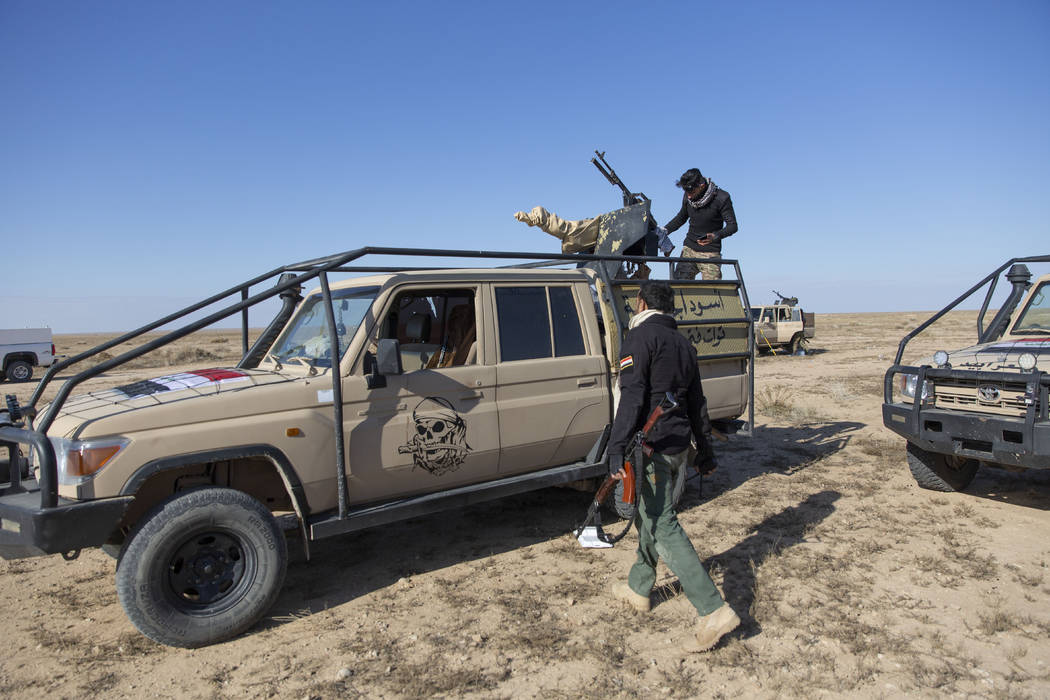 Paramilitary Popular Mobilization Forces and local tribal militias participate in the military ...