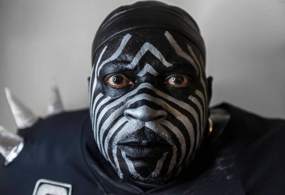 Raiders super fan Wayne Mabry, known as "Violator," in his hotel room at 4 a.m. in Du ...