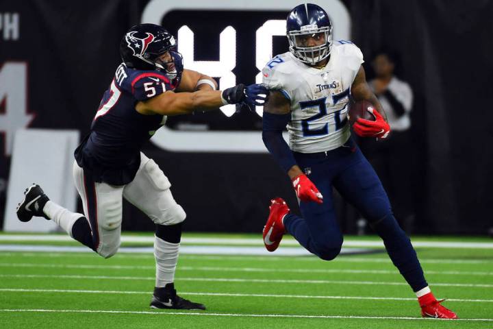 Tennessee Titans running back Derrick Henry (22) breaks away from Houston Texans outside lineba ...